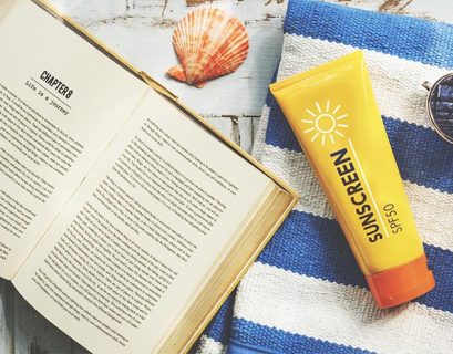 sunscreen sunglasses towel book recess relax concept